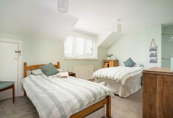 Bedroom 3 has twin beds perfect for young adults or children to settle into each night.