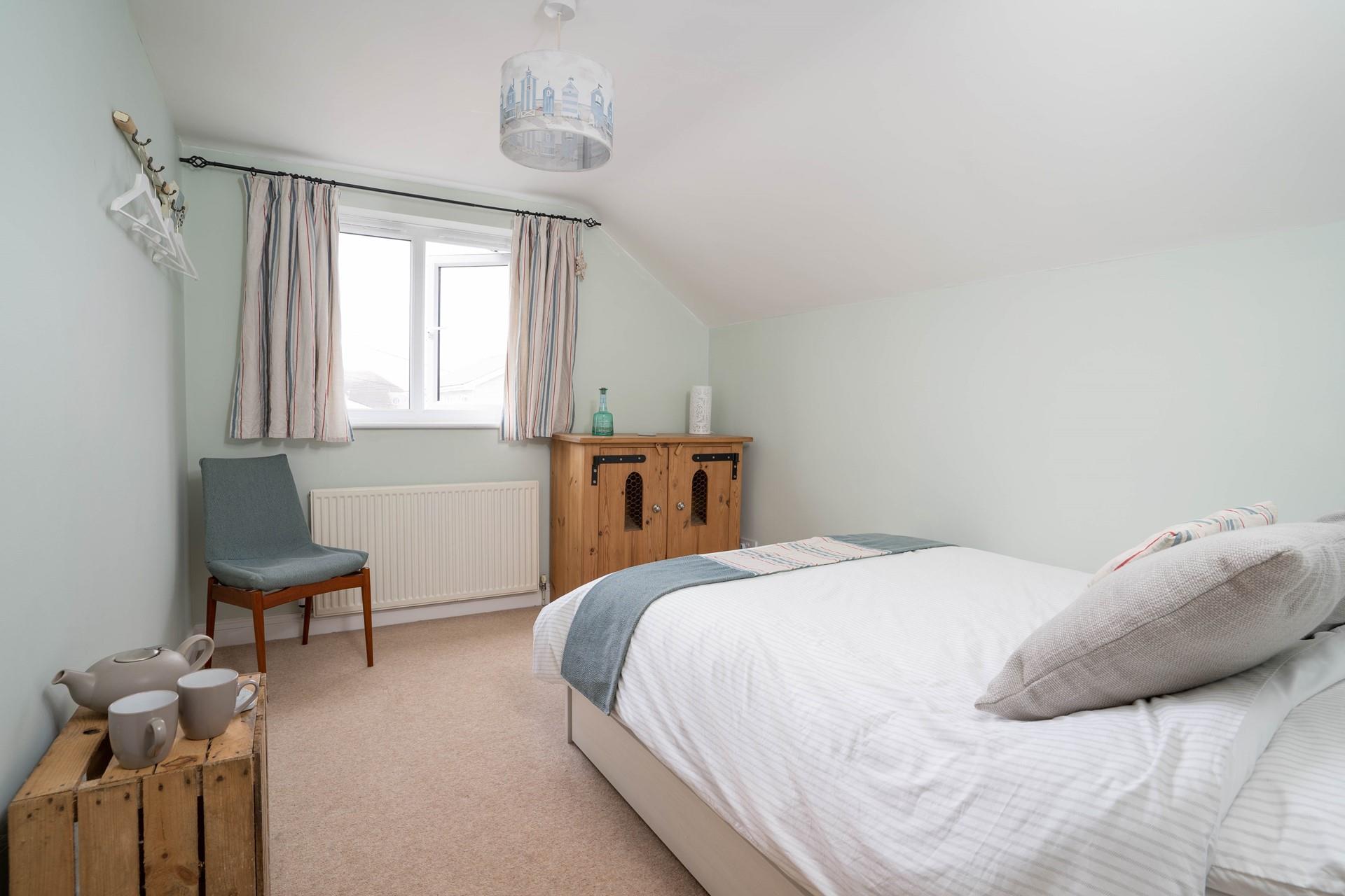 Bedroom 2 has a spacious double bed perfect for a dreamy night's sleep.