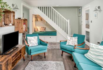 Stylish furnishings await in the cosy sitting room.