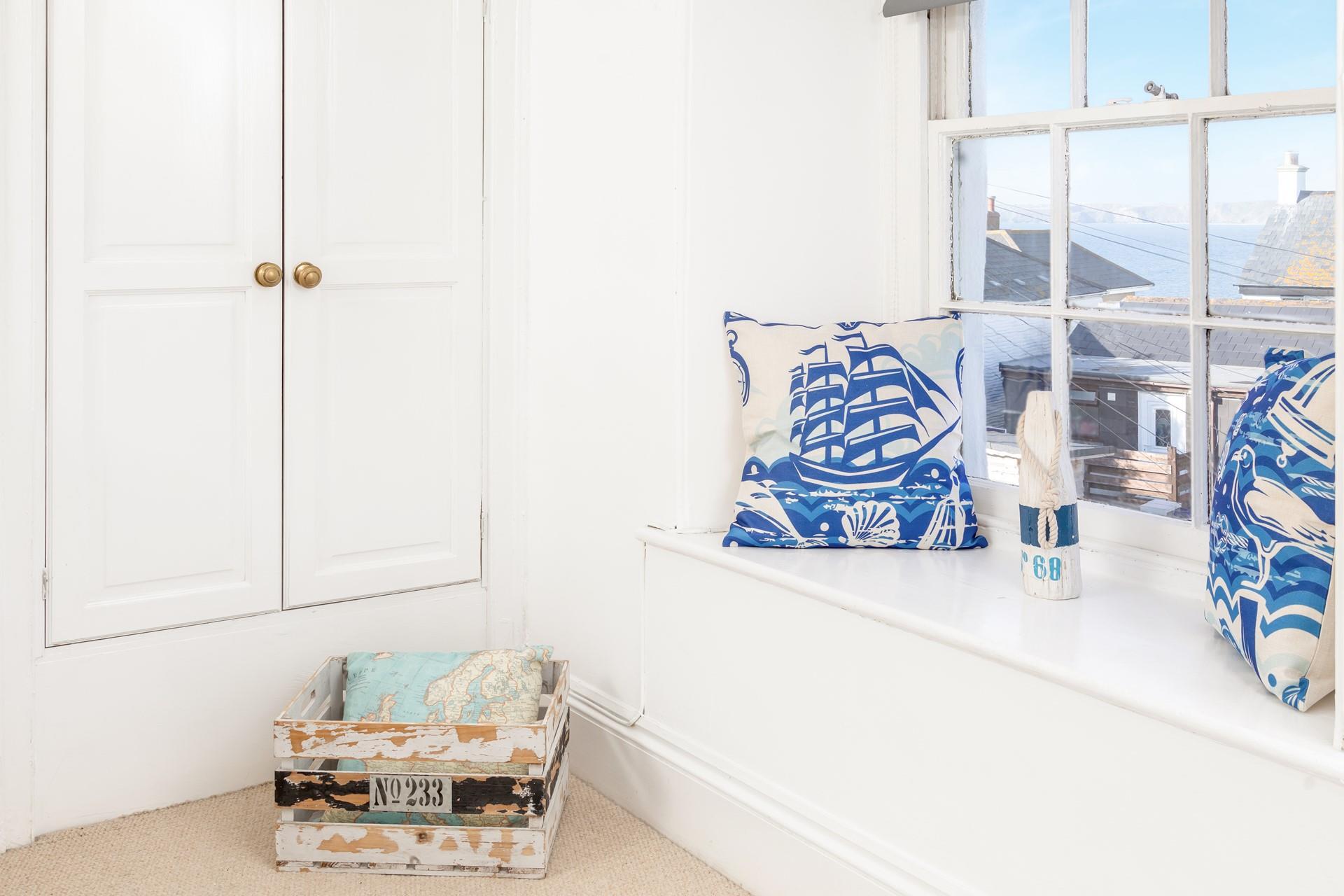 Traditional sash windows look out over the rear garden from bedroom 3.