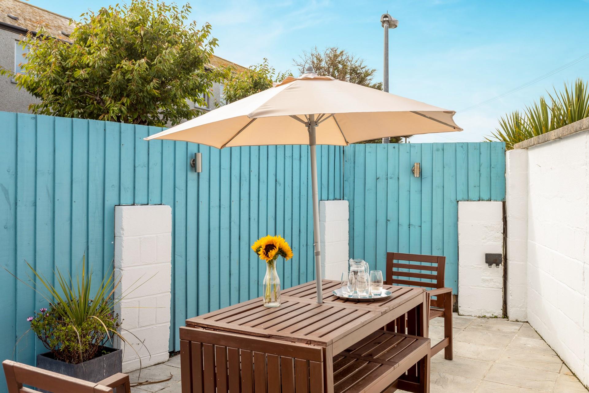 The rear terrace is a delightful suntrap on a summer's afternoon, for enjoying a BBQ with friends. 