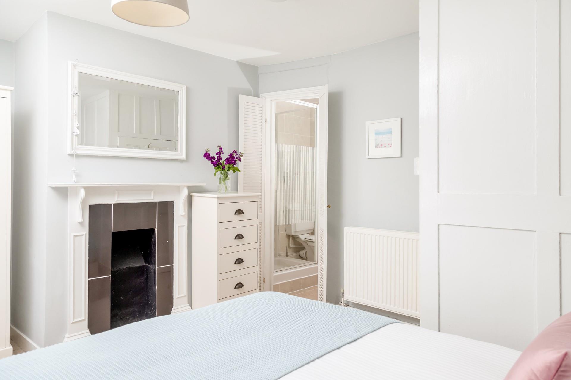 The beautiful feature fireplace adds character to your cosy double bedroom.