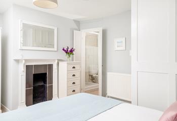 The beautiful feature fireplace adds character to your cosy double bedroom.
