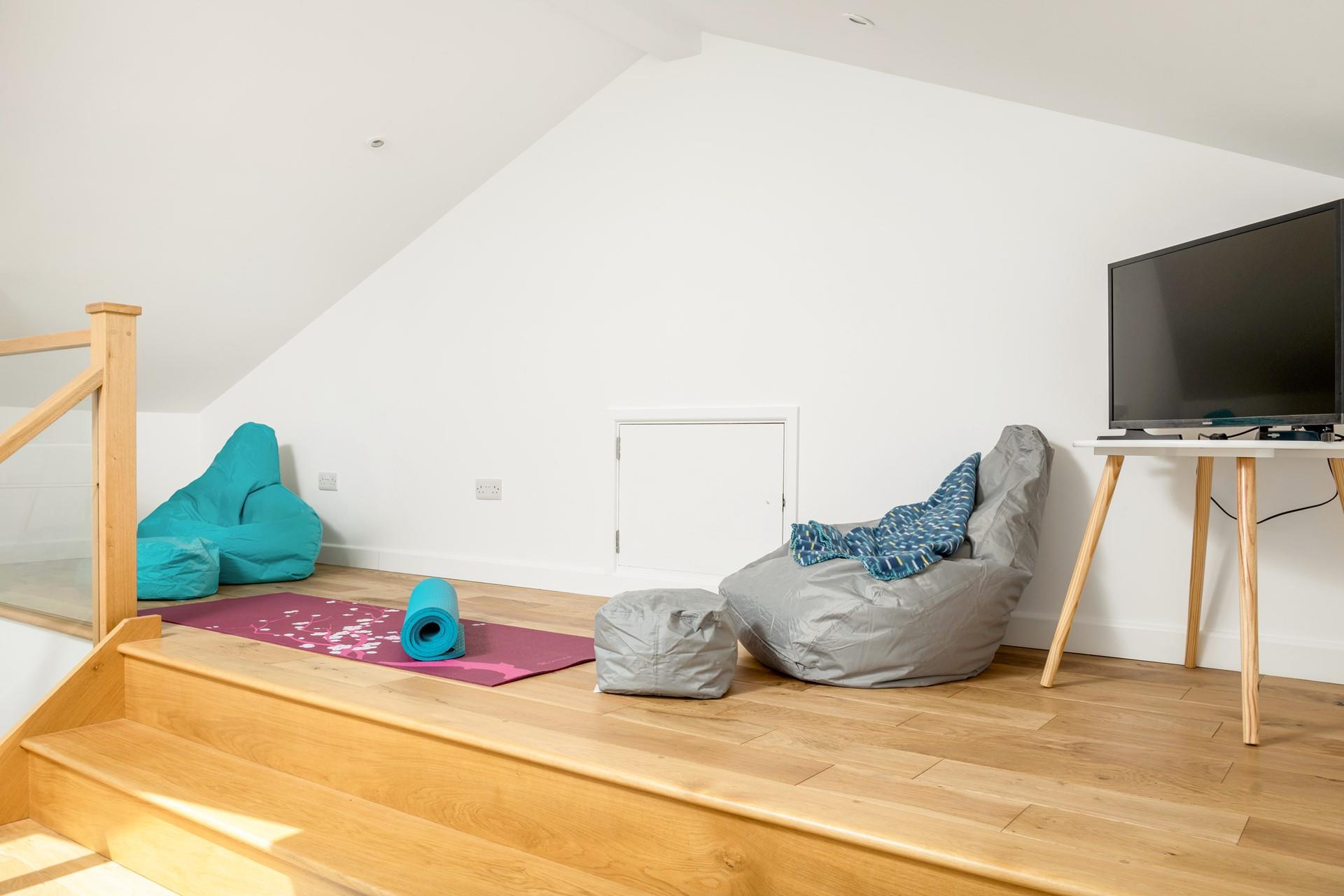 Enjoy some relaxation with some yoga in the snug.