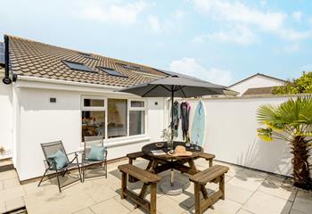 Dry off wetsuits in the suntrap garden after a day of surfing on the beach.