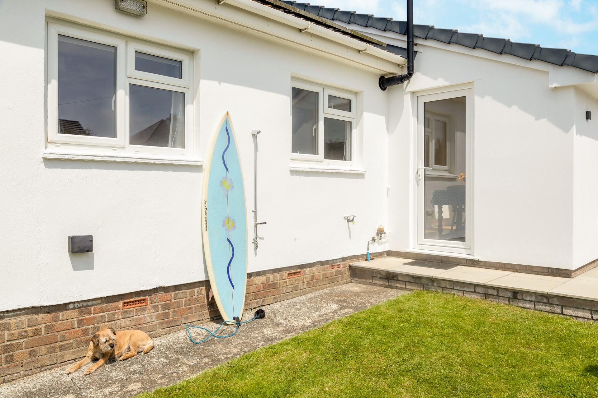 The outdoor heated shower is perfect for washing sandy feet and paws.