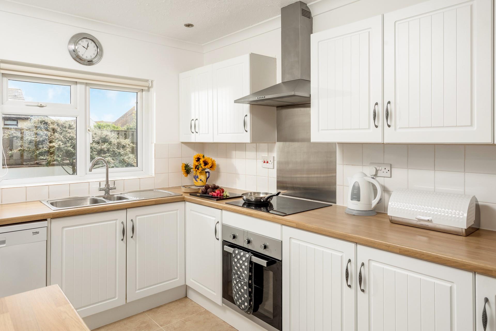 The kitchen is modern and well-equipped for cooking delicious dinners and filling breakfasts.