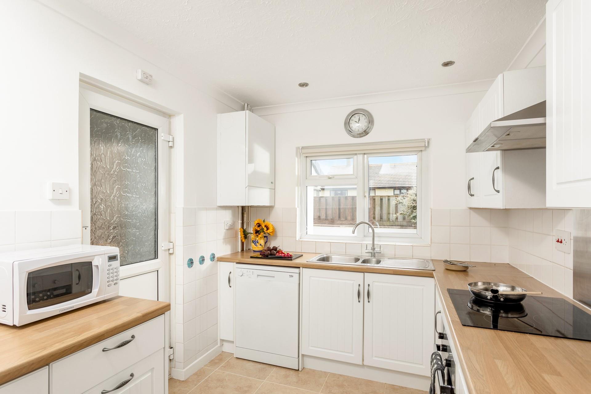 The kitchen area has all the amenities needed to cook or head out to sample the local restaurants. 