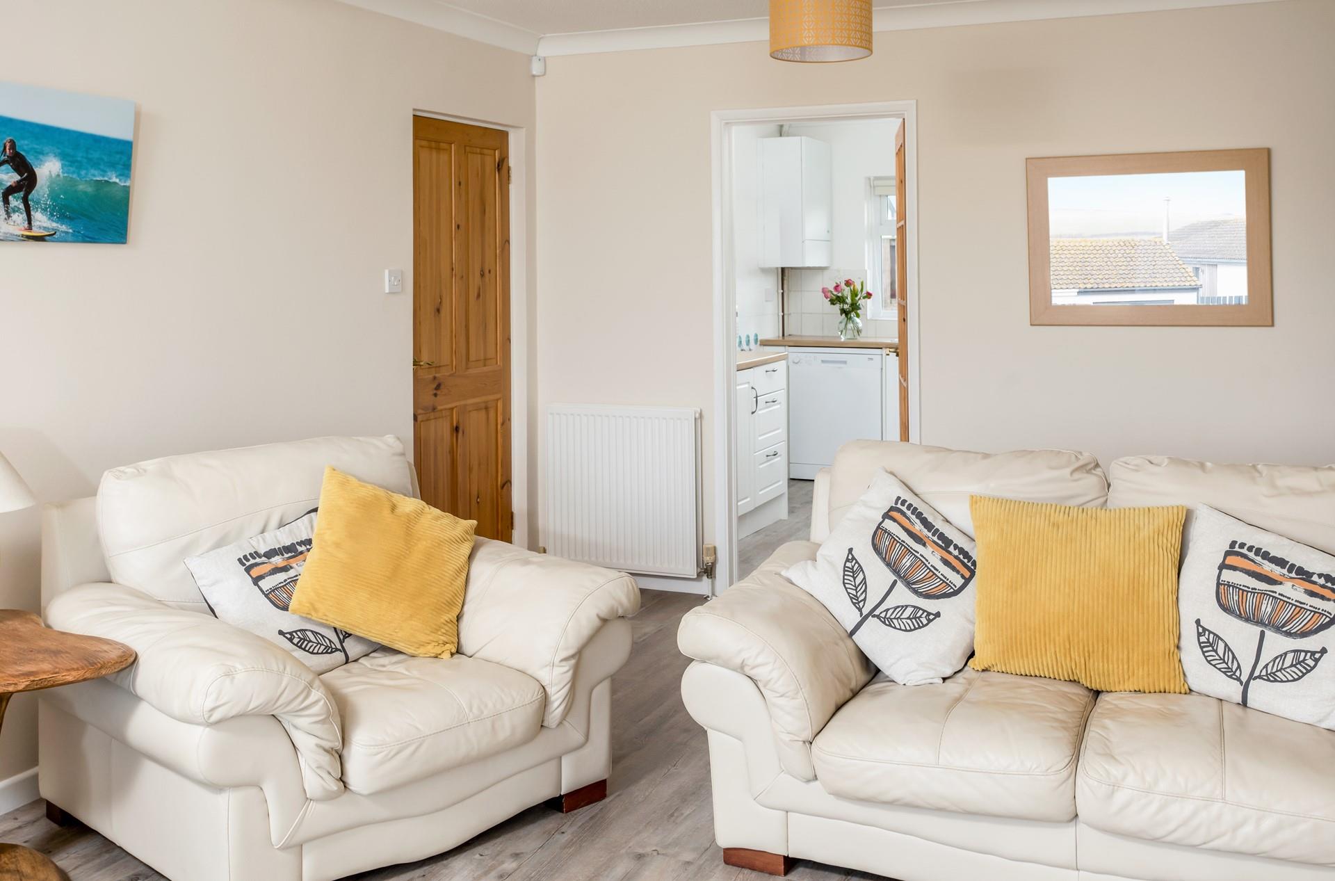 The large sofa in the sitting room is super comfy, perfect for enjoying family movie nights.