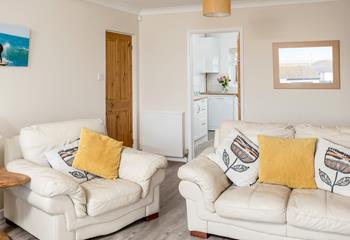 The large sofa in the sitting room is super comfy, perfect for enjoying family movie nights.