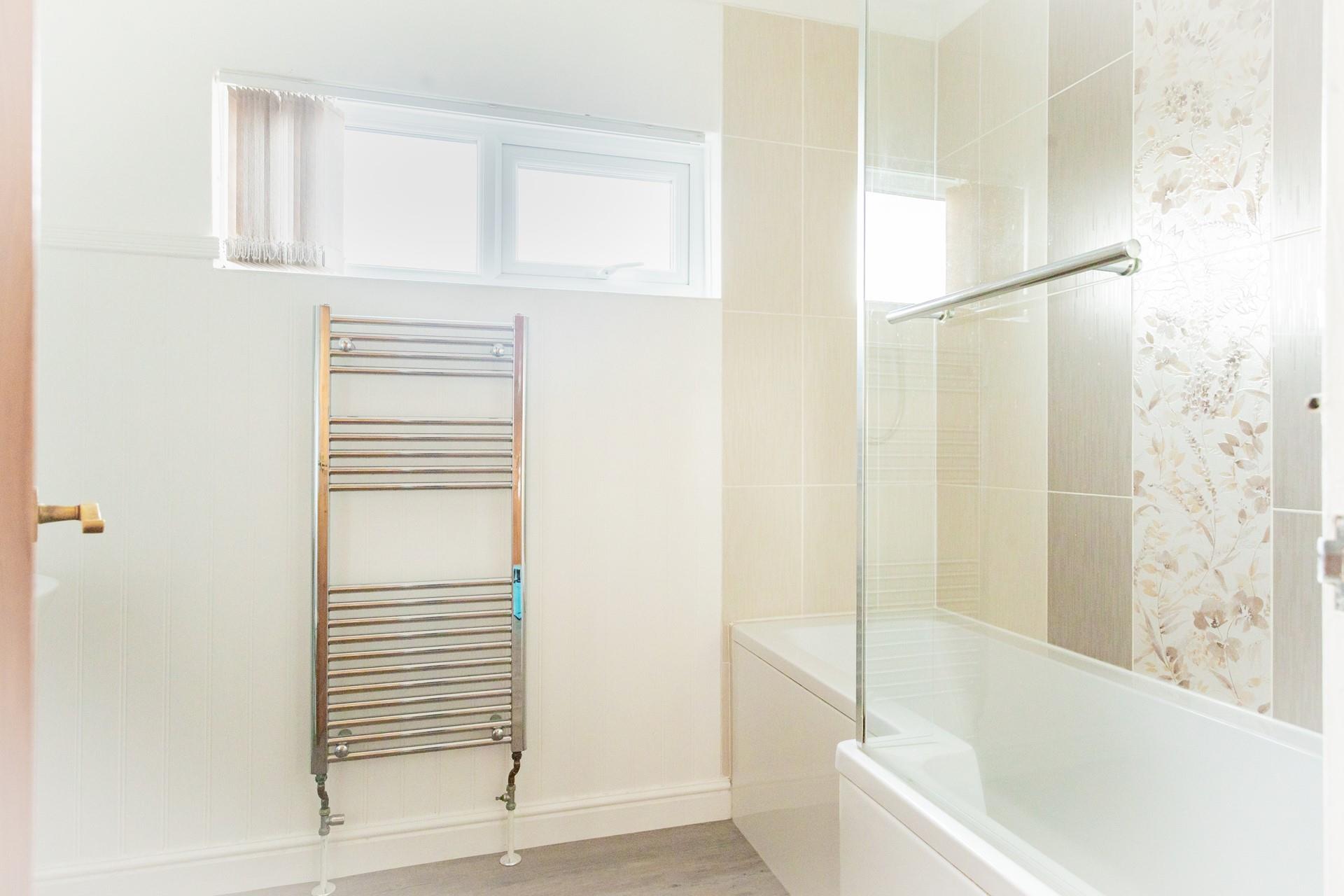 Grab warm fluffy towels from the heated rail after a relaxing bath.