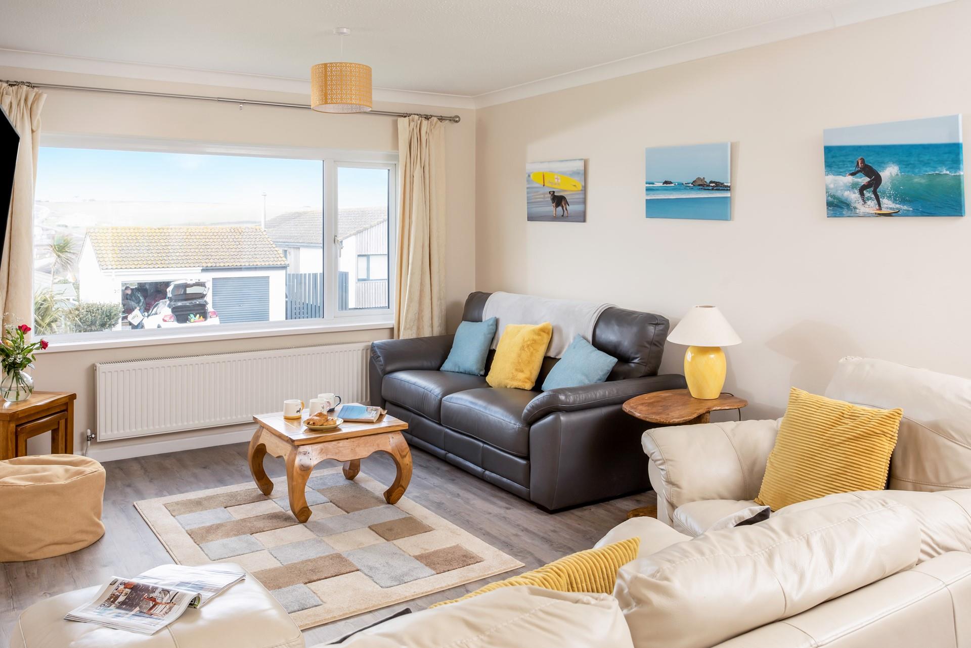 Gaze out at the sea view from the sitting room window with drinks and snacks.