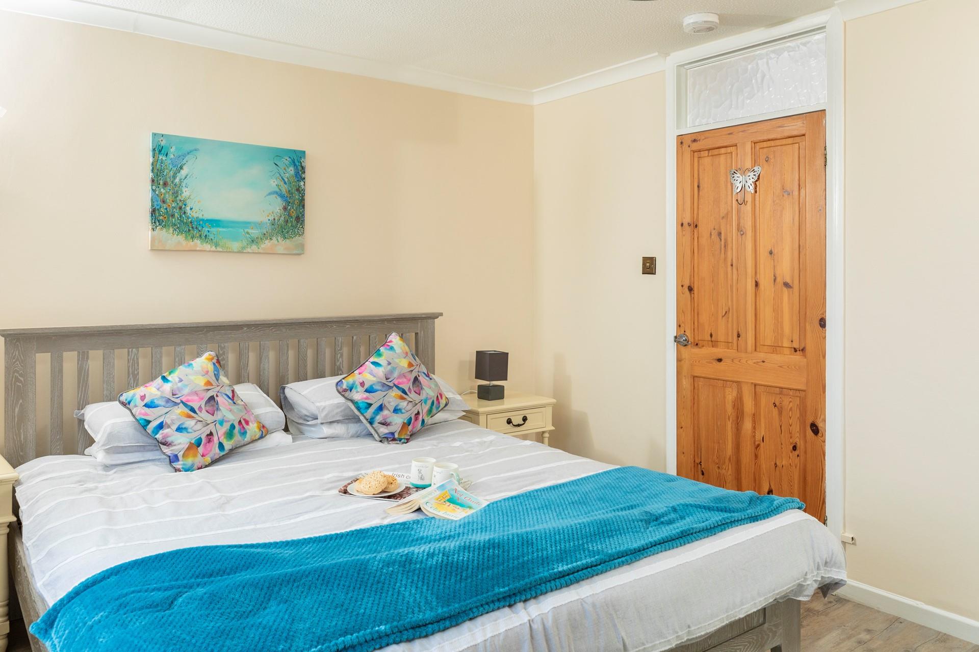 Bedroom 3 has a spacious king size bed for a relaxing night's slumber.