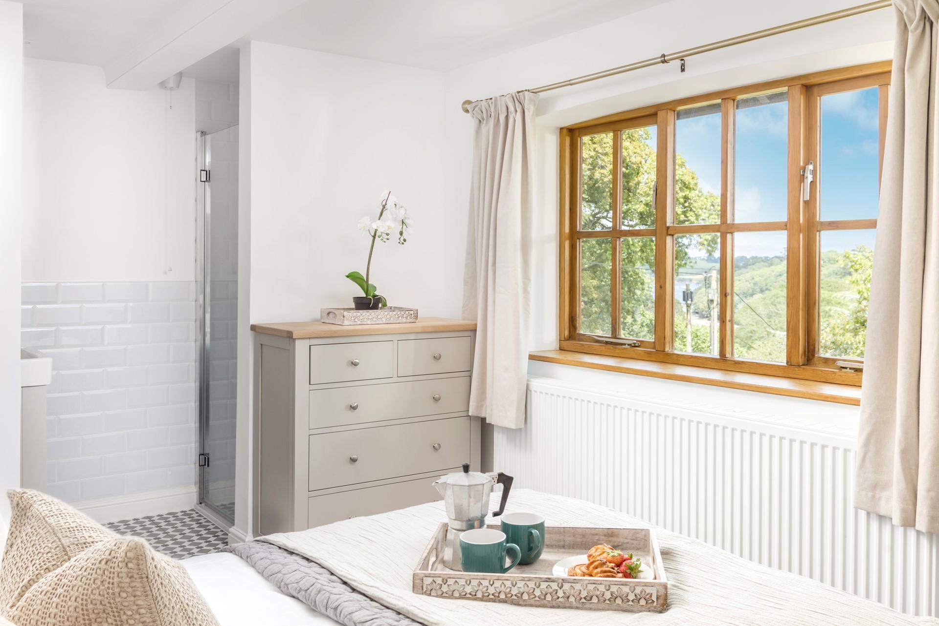 Gaze at the glistening Helford River from your bedroom window.