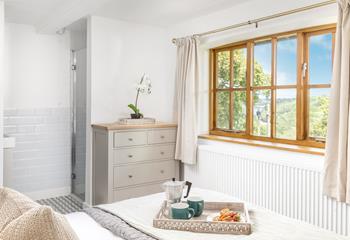 Gaze at the glistening Helford River from your bedroom window.