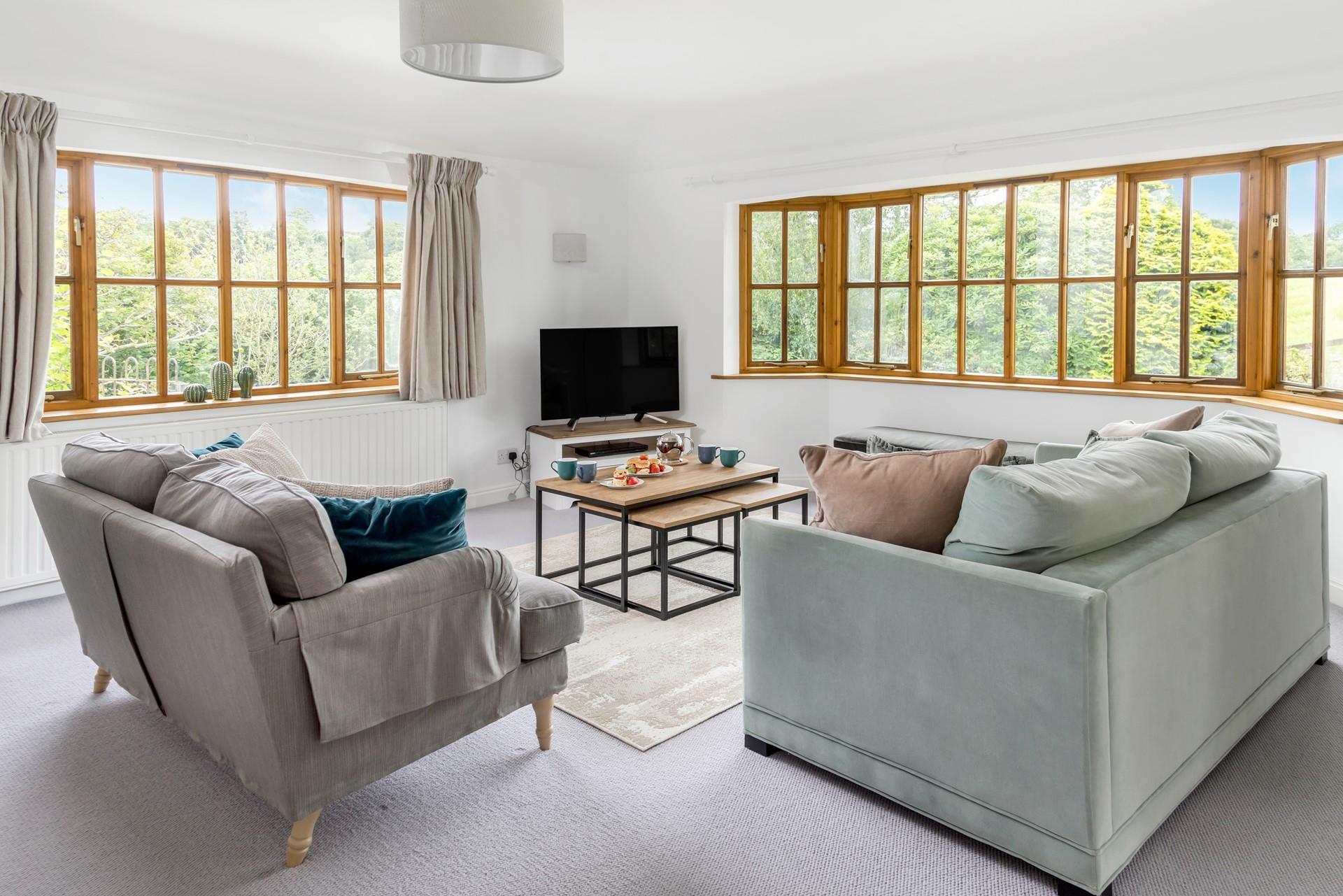 Gaze out at your wrap-around garden and relax in the living area.