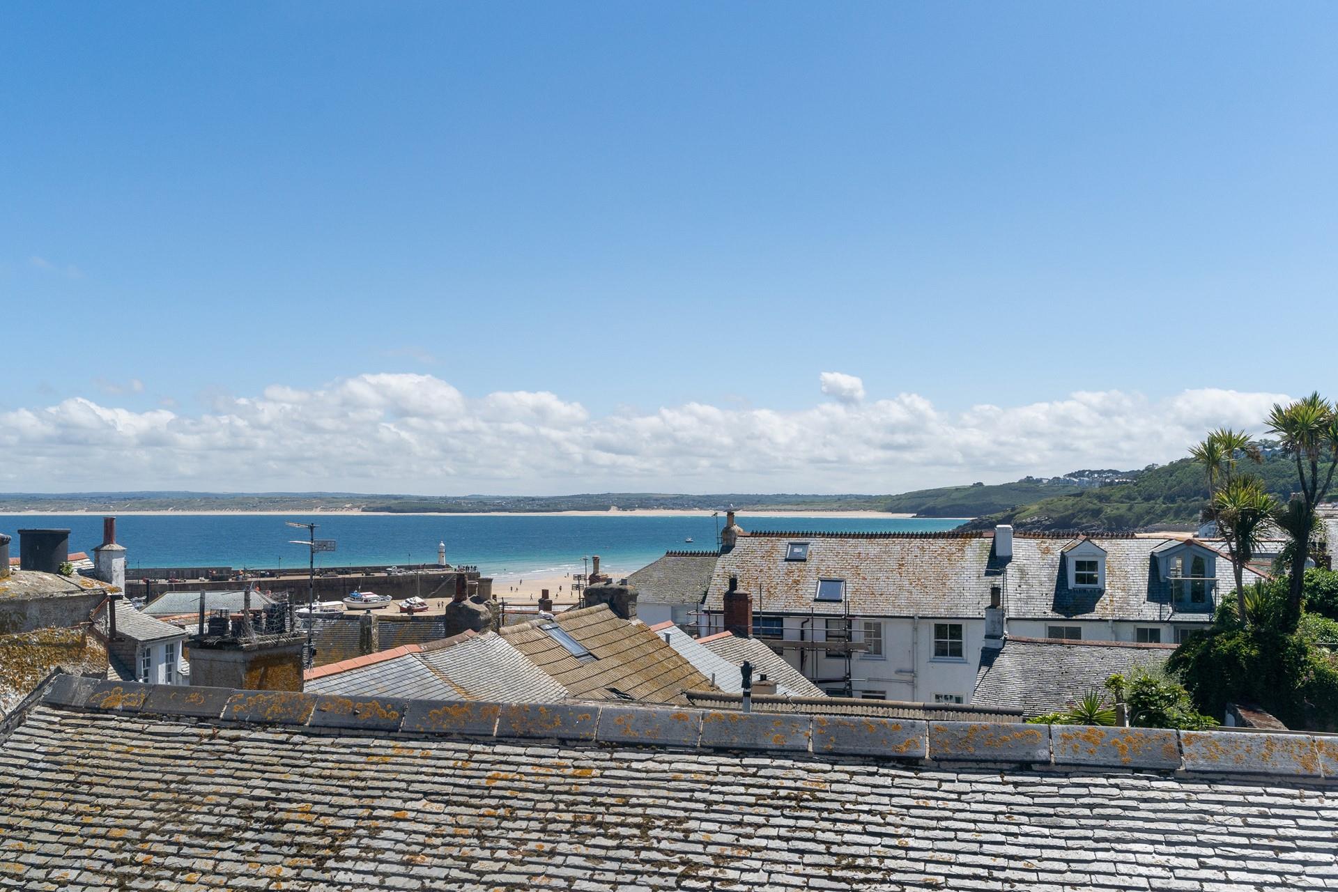 There is a beautiful view of the Bay over the quirky rooftops of the town.