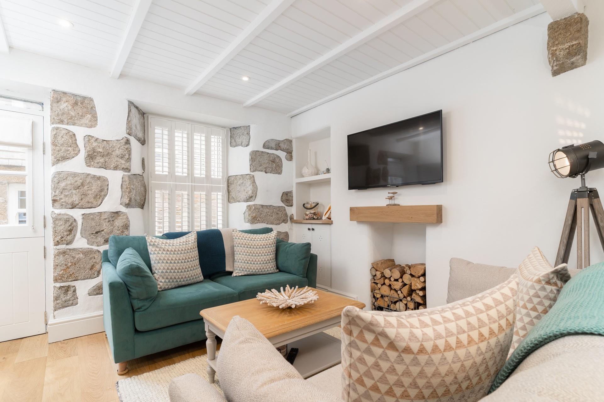 The sitting room is beautifully furnished which creates a cosy space for the whole family.