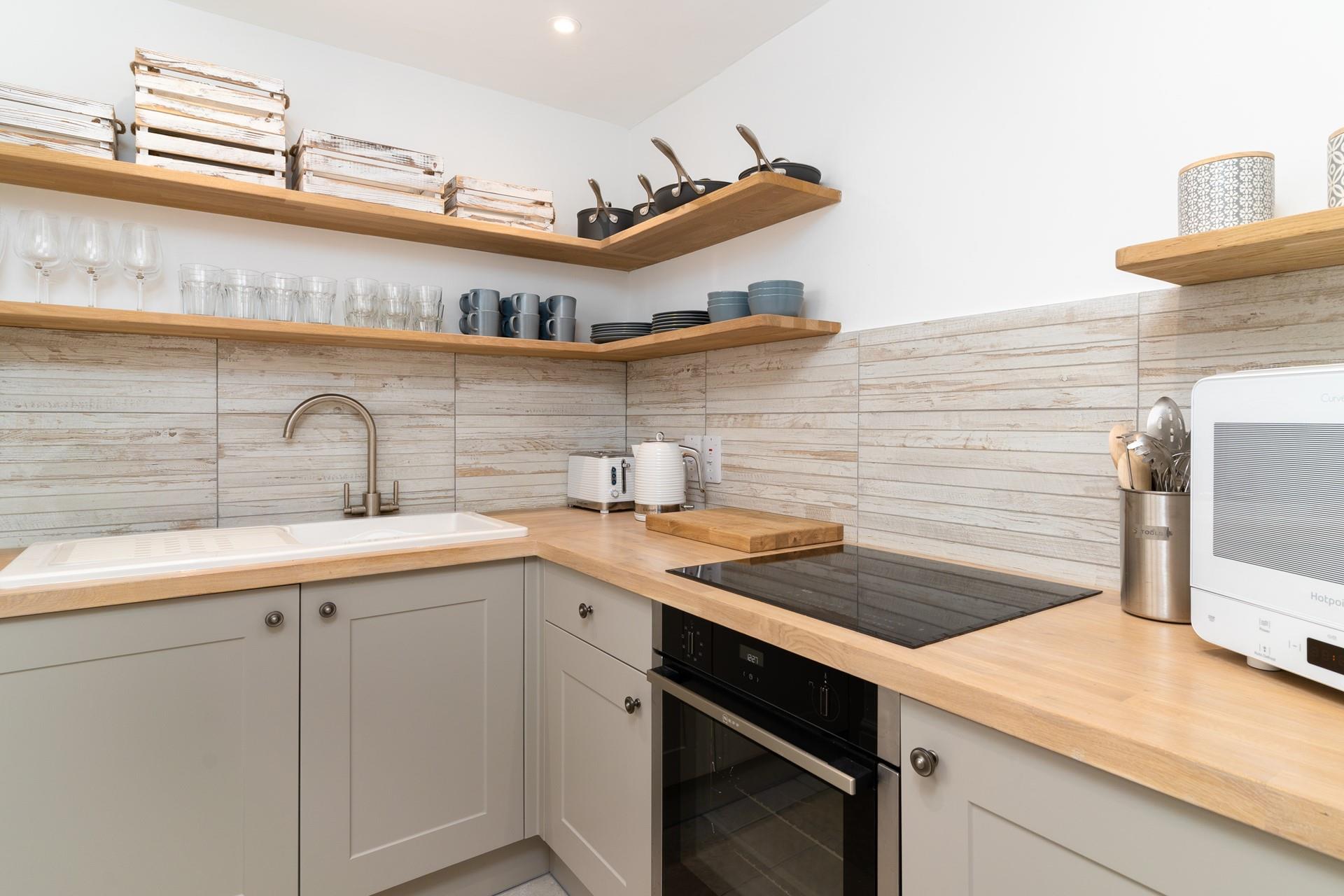 The modern kitchen is well-equipped for rustling up delicious meals.