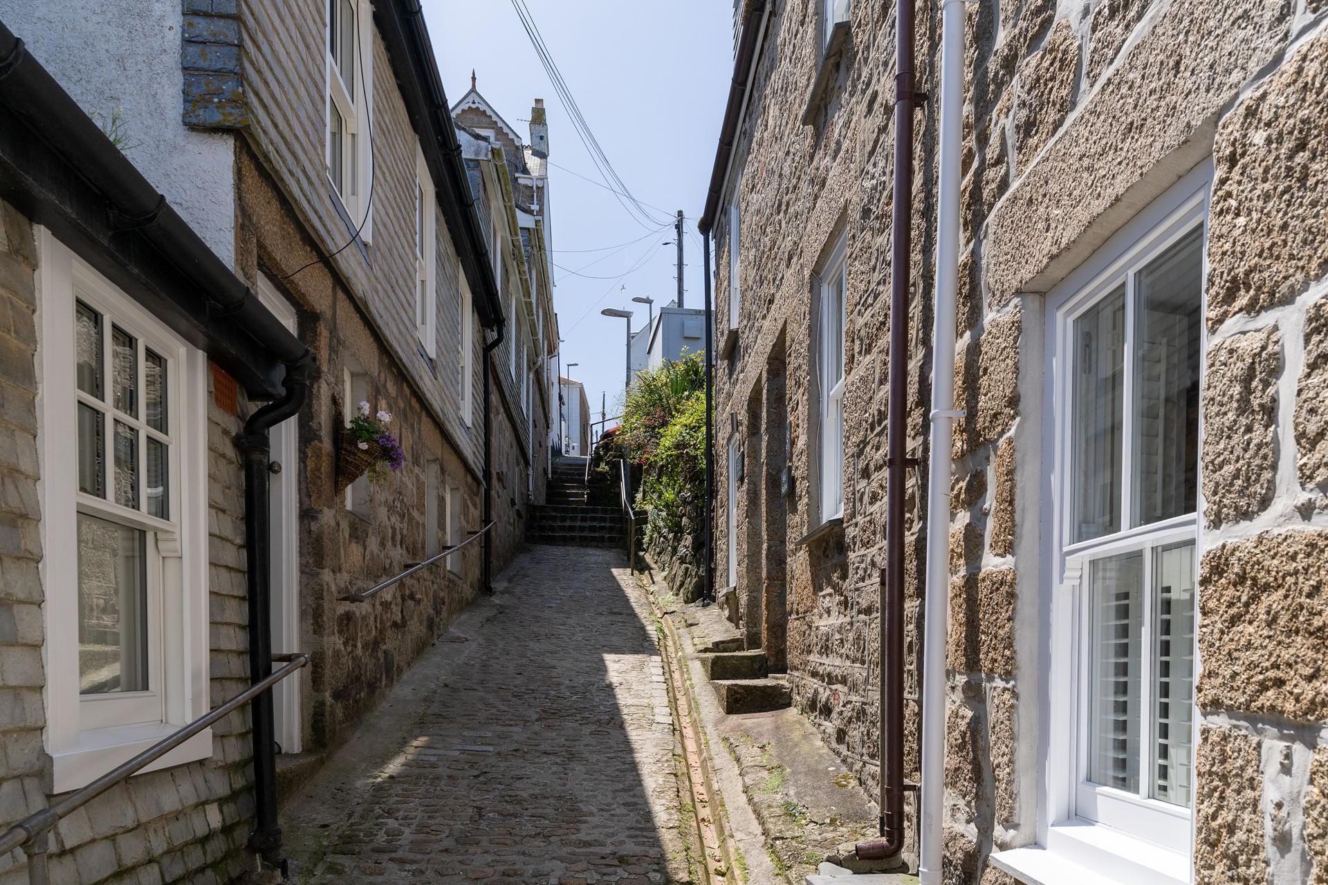 Located down a quaint cobbled street, you are just steps away from feeling the sand between your toes.