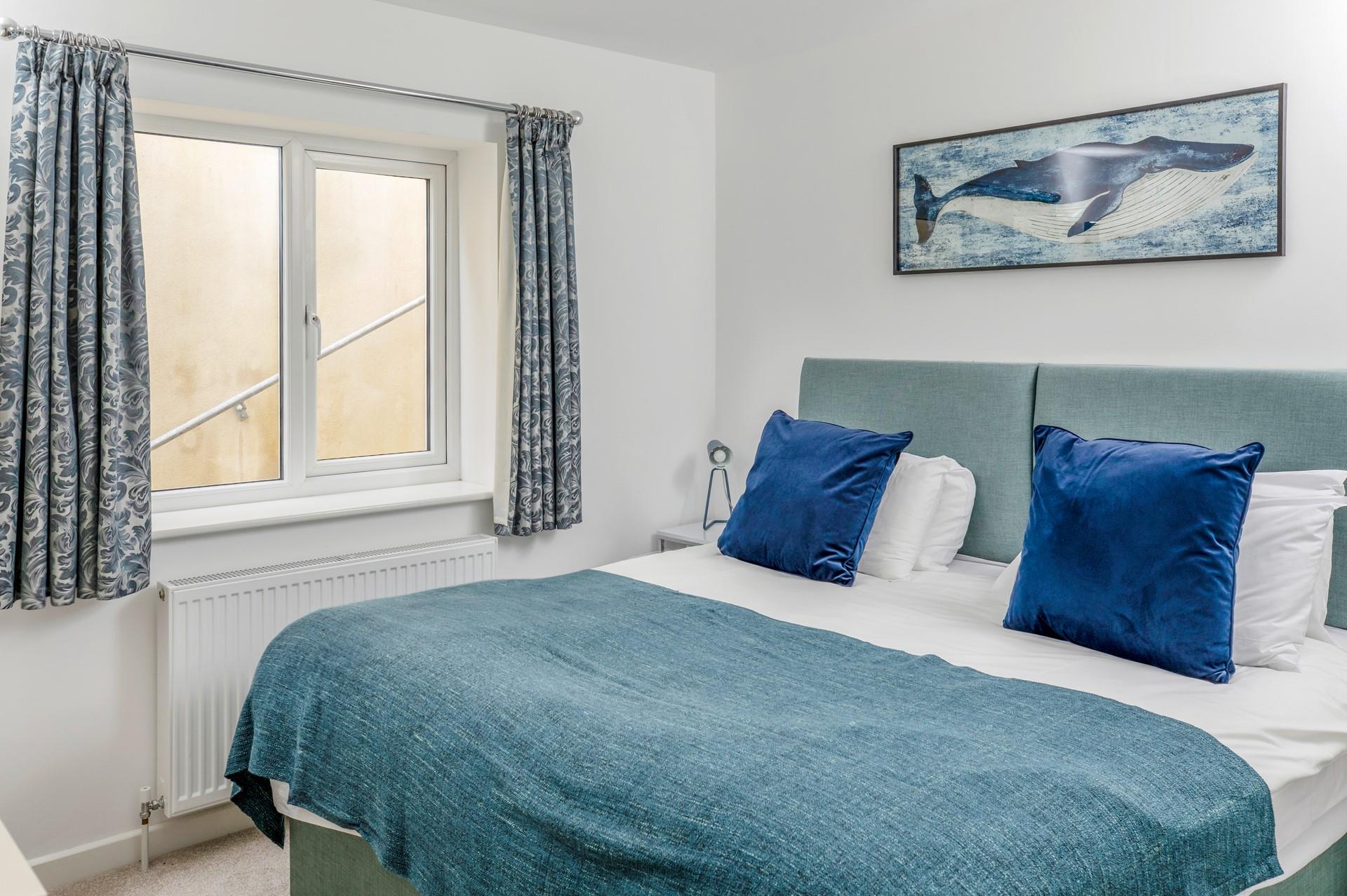 Calming and peaceful, the master bedroom promises a blissful night's sleep.