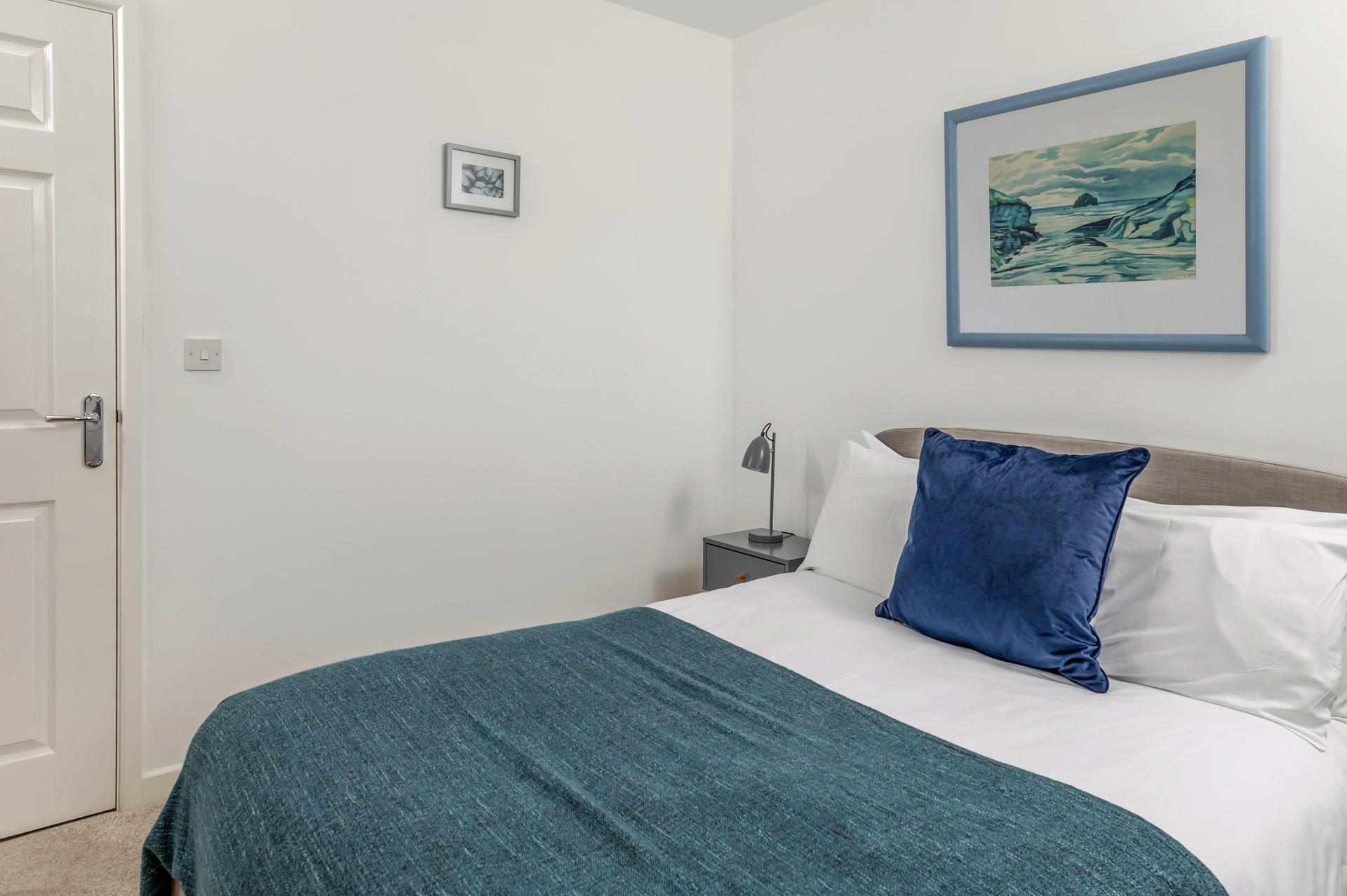 You'll sleep soundly in the serene bedroom.