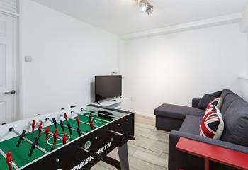 Enjoy a game of table football or snuggle up on the sofa to watch the Smart TV, in the ground floor games room, with the added benefit of a WC just outside the door.