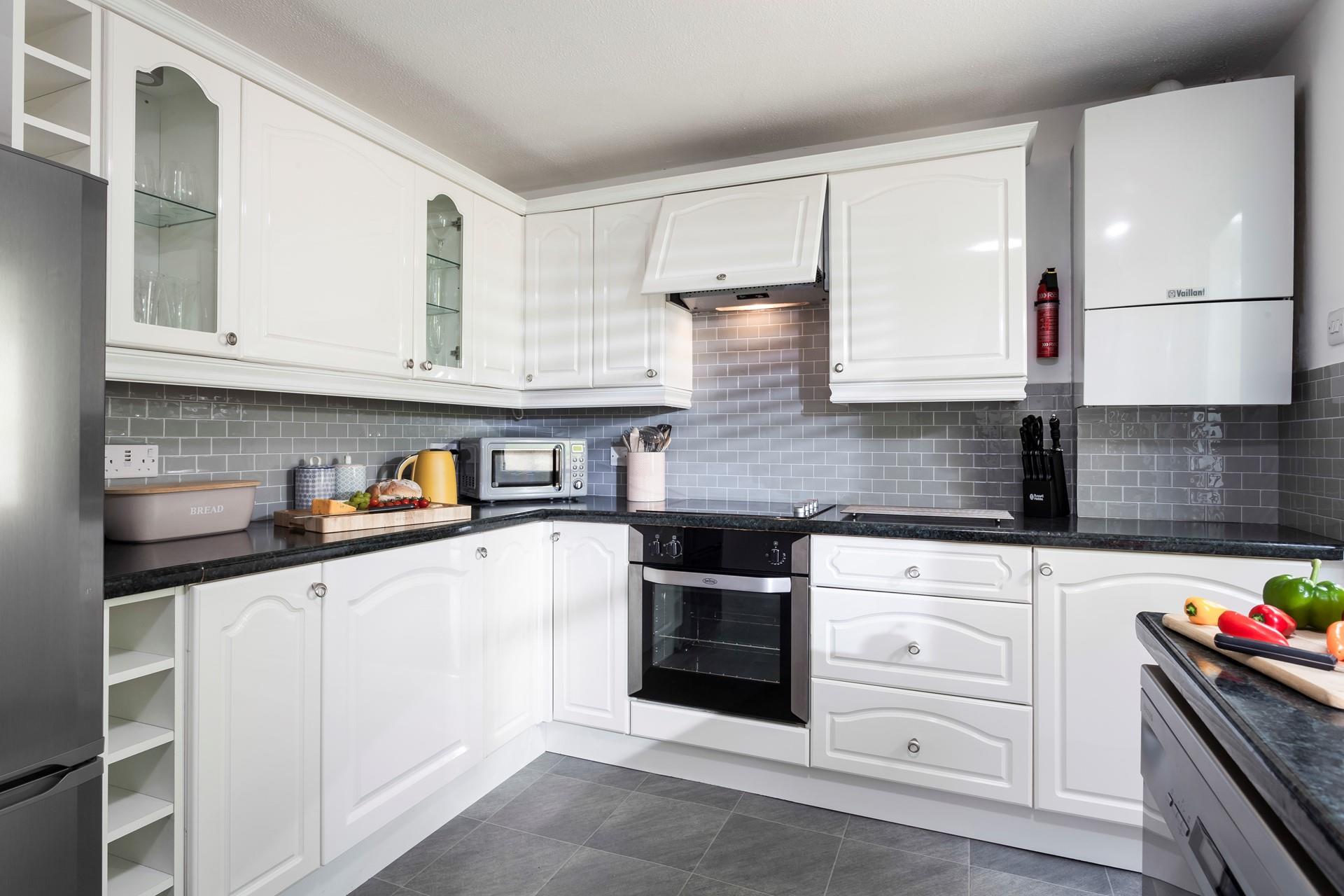 The kitchen also leads to the rear exit of the property. 