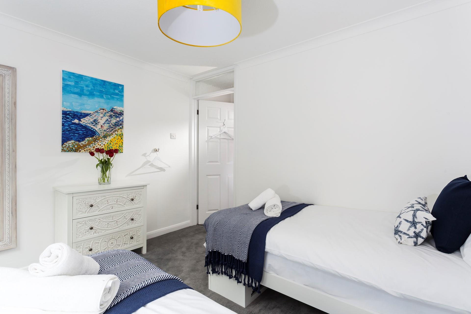 This comfortable twin or king size bedroom is located at the rear of the property. 