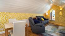 Relax on your reclining sofa with a cup of tea in hand.
