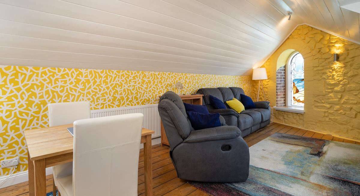 Relax on your reclining sofa with a cup of tea in hand.