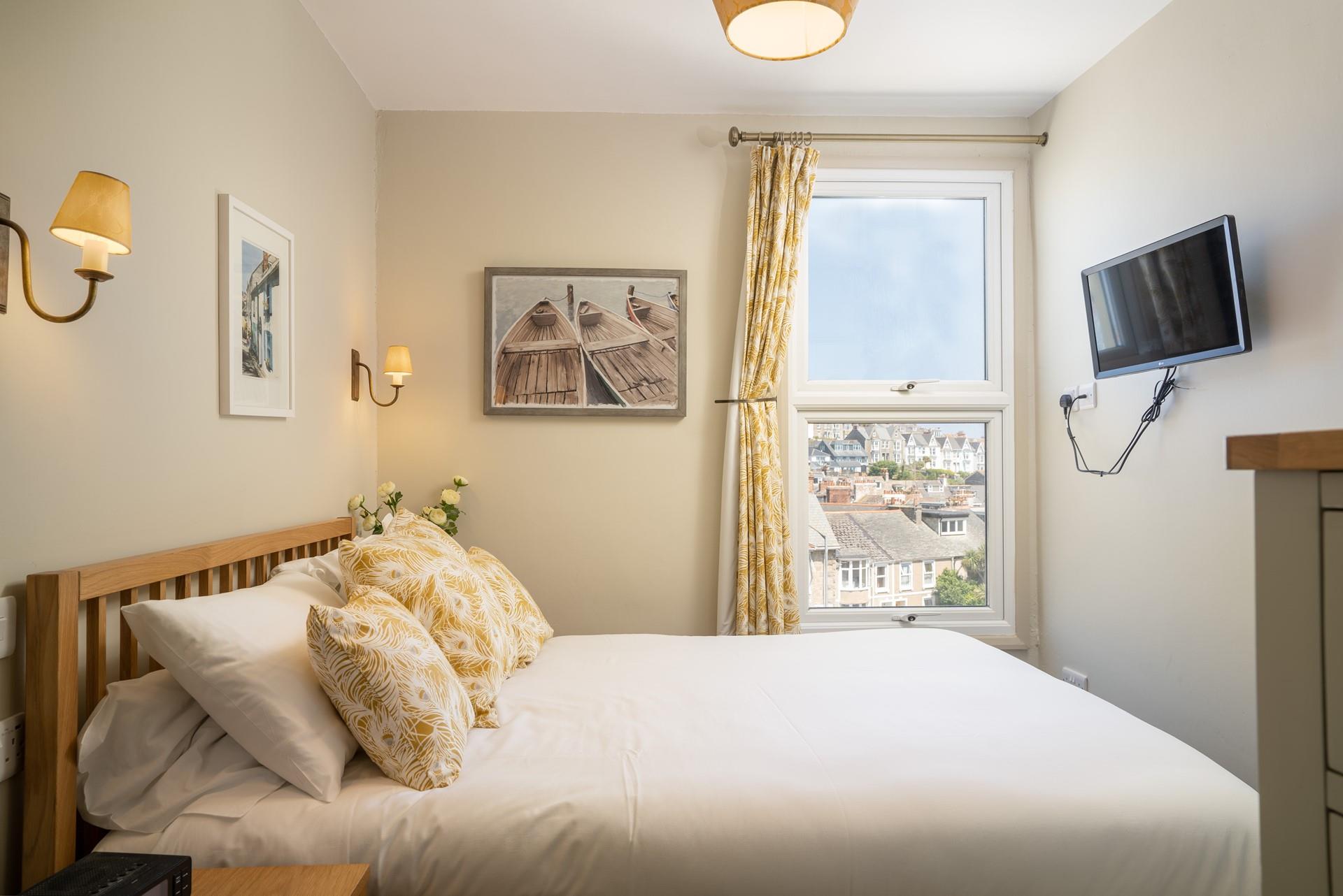 Exhausted from a day in the sun, real in bed and drift off to sleep in your cosy double bed.