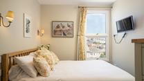 Exhausted from a day in the sun, real in bed and drift off to sleep in your cosy double bed.