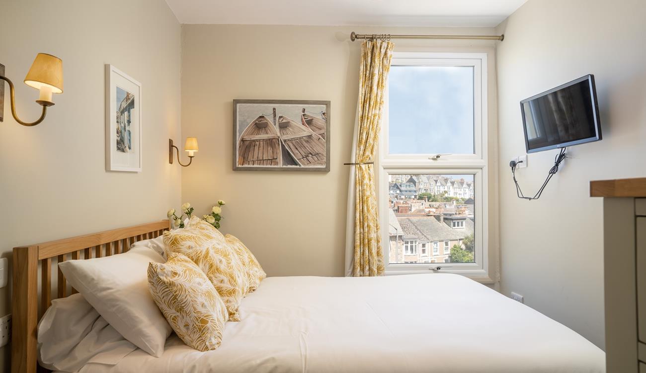 Exhausted from a day in the sun, real in bed and drift off to sleep in your cosy double bed.