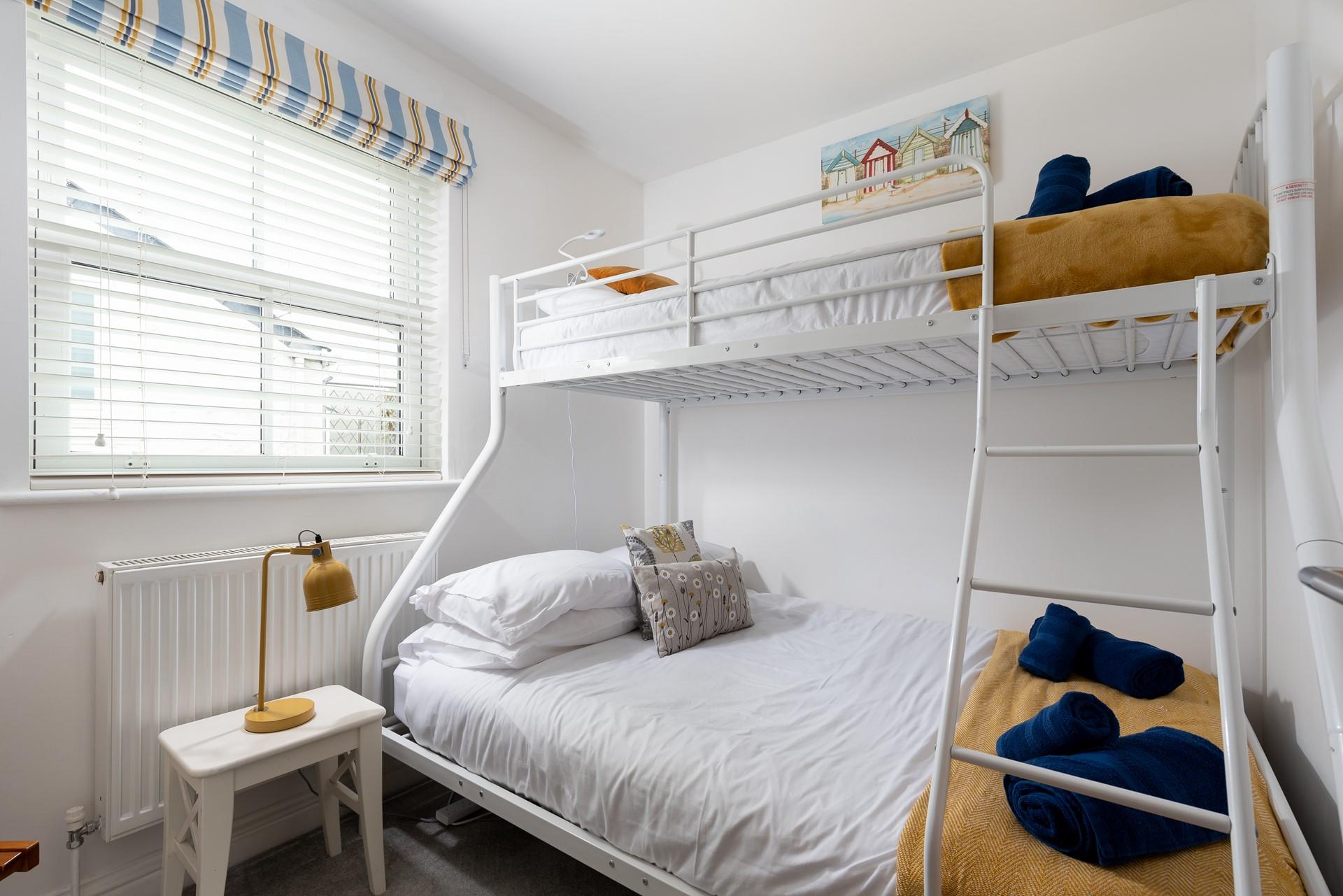Bedroom 2 has triple bunk beds- perfect for a kid's sleepover!