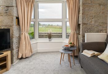 Enjoy the sea views from the bay window.