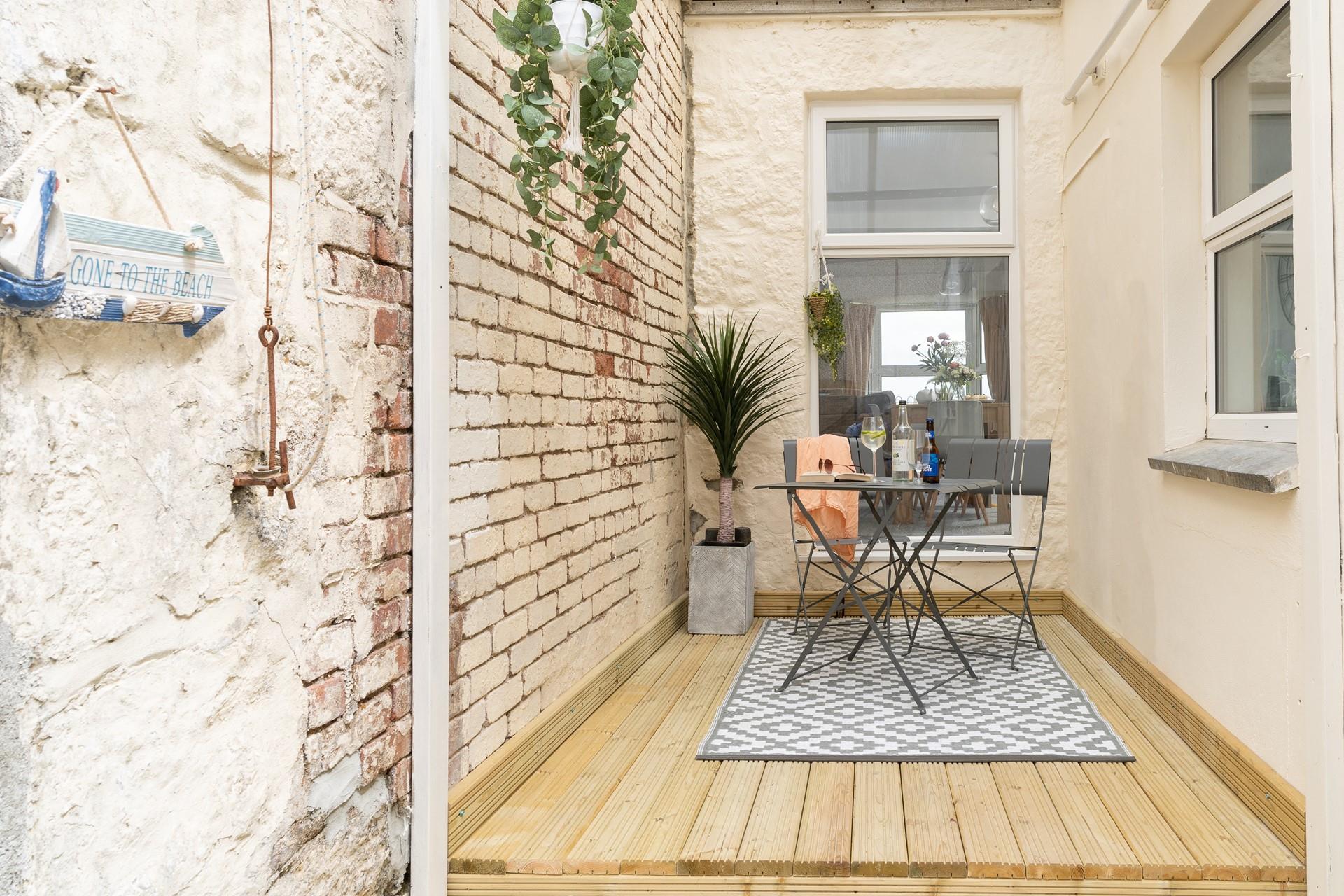 Sip a glass of your favourite wine on the decking.