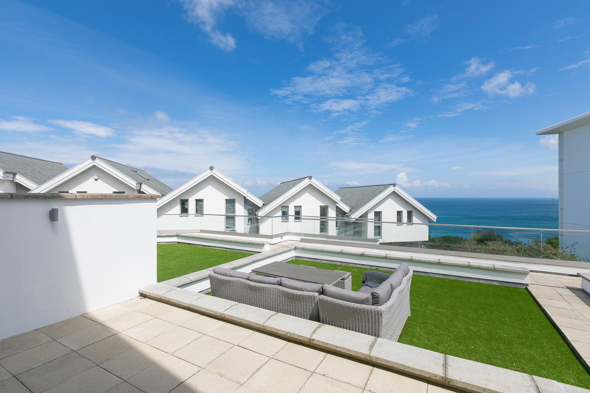 Sit outside and gaze out at the beautiful turquoise sea.