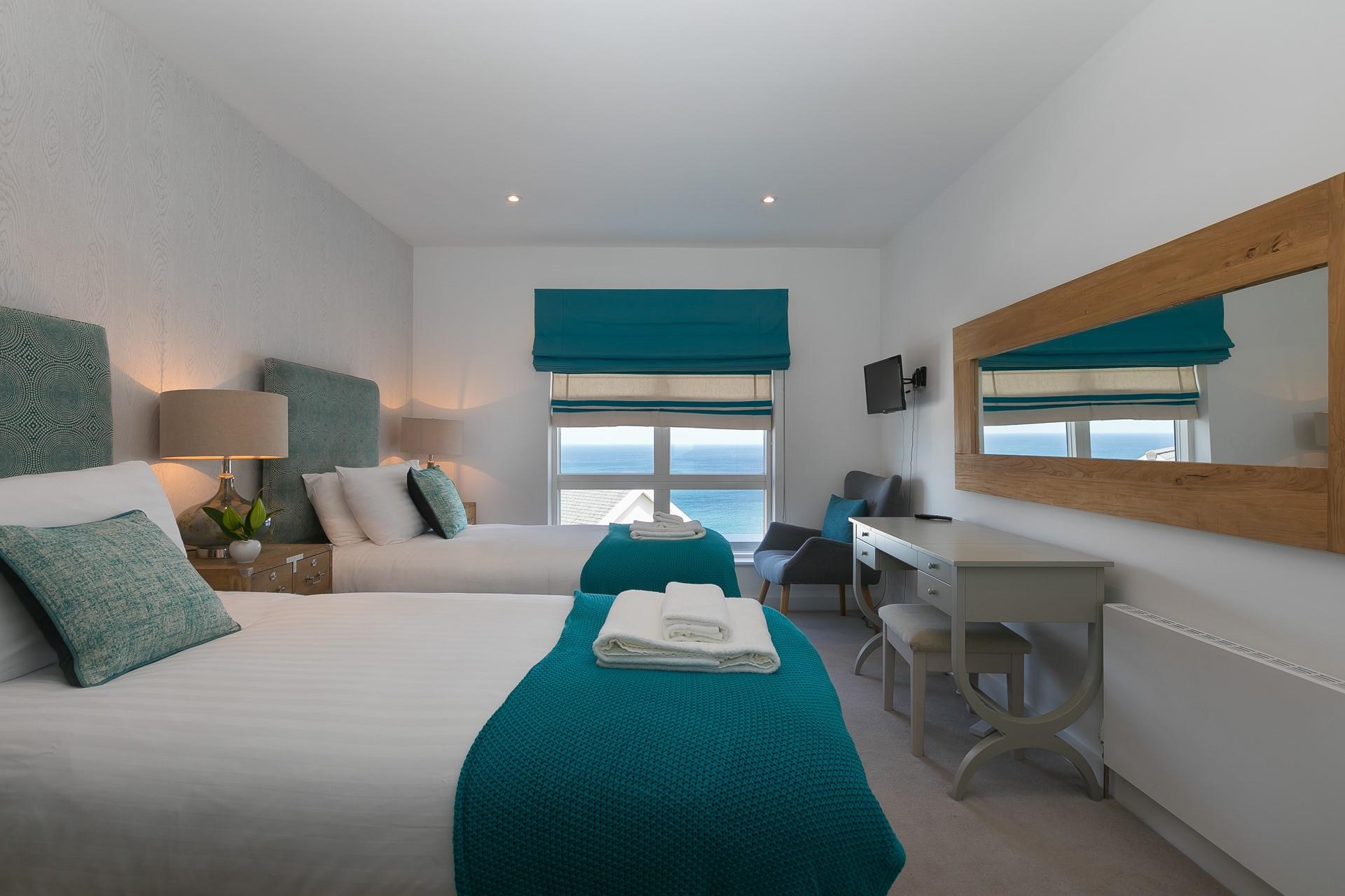The bedrooms are decorated to reflect the close proximity to the sea.