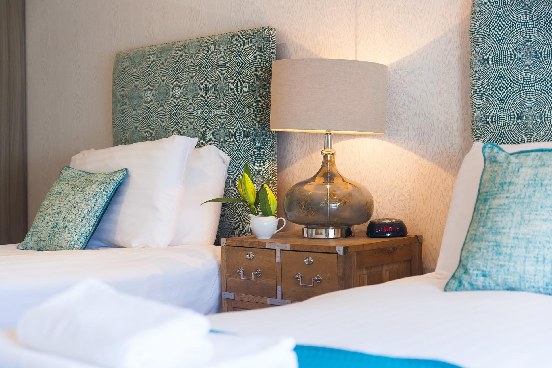 The stylish furnishings like the lamps create a luxury feel to the apartment.