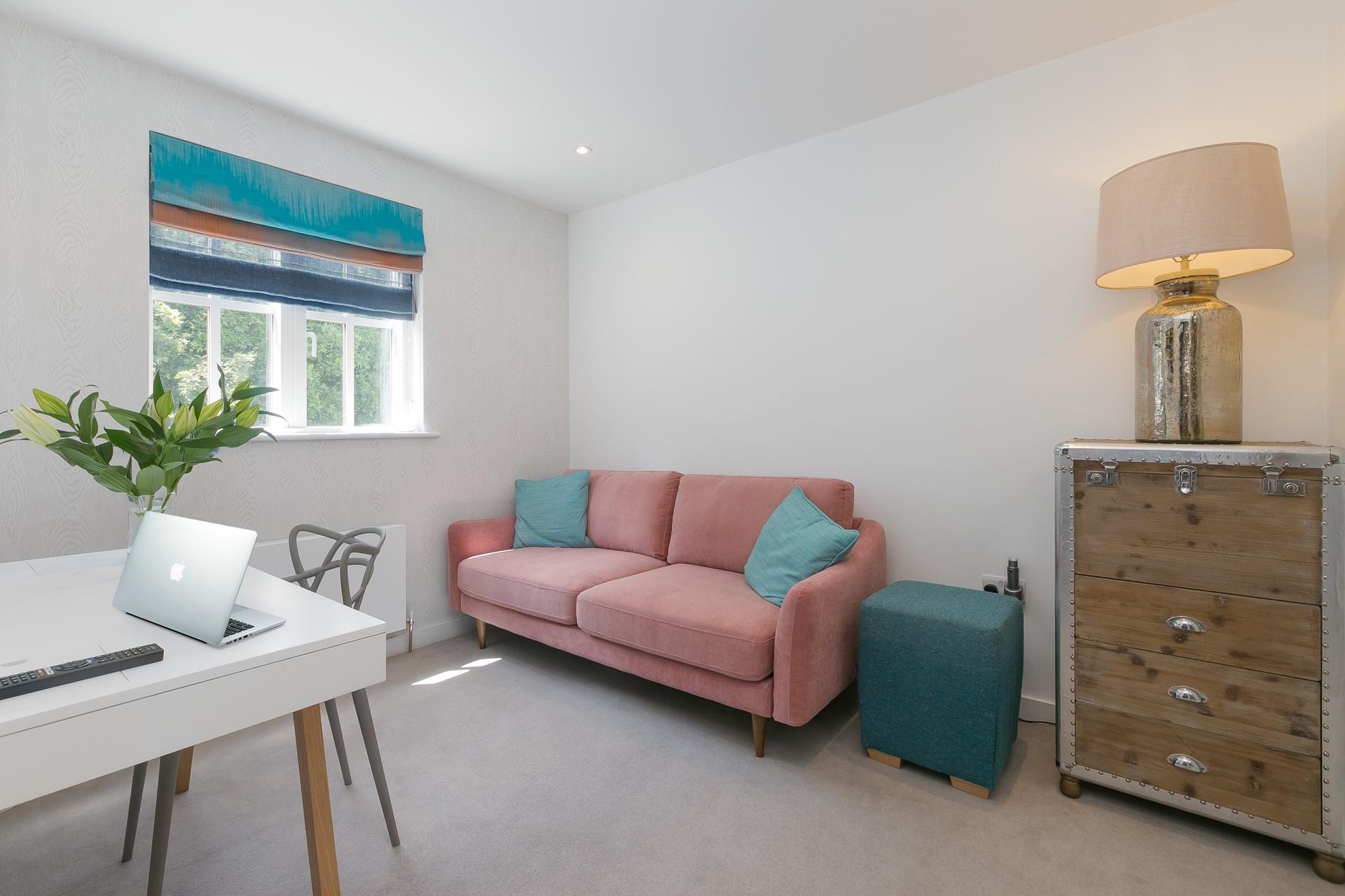 The snug area has a sofa and a smart TV for the kids to enjoy downtime away from the adults.