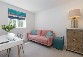 The snug area has a sofa and a smart TV for the kids to enjoy downtime away from the adults.