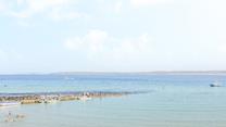 Swim in the turquoise waters and sunbathe on the soft sandy beach.