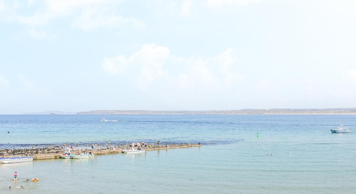 Swim in the turquoise waters and sunbathe on the soft sandy beach.