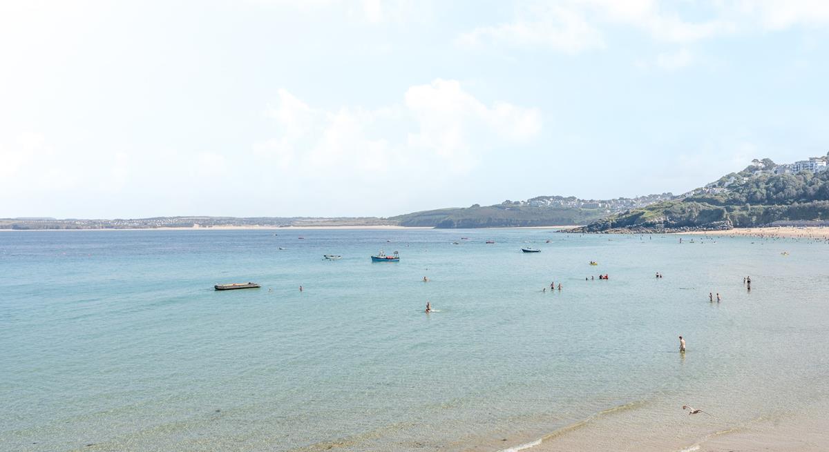 Sit on the beach and enjoy stunning views across St Ives Bay.