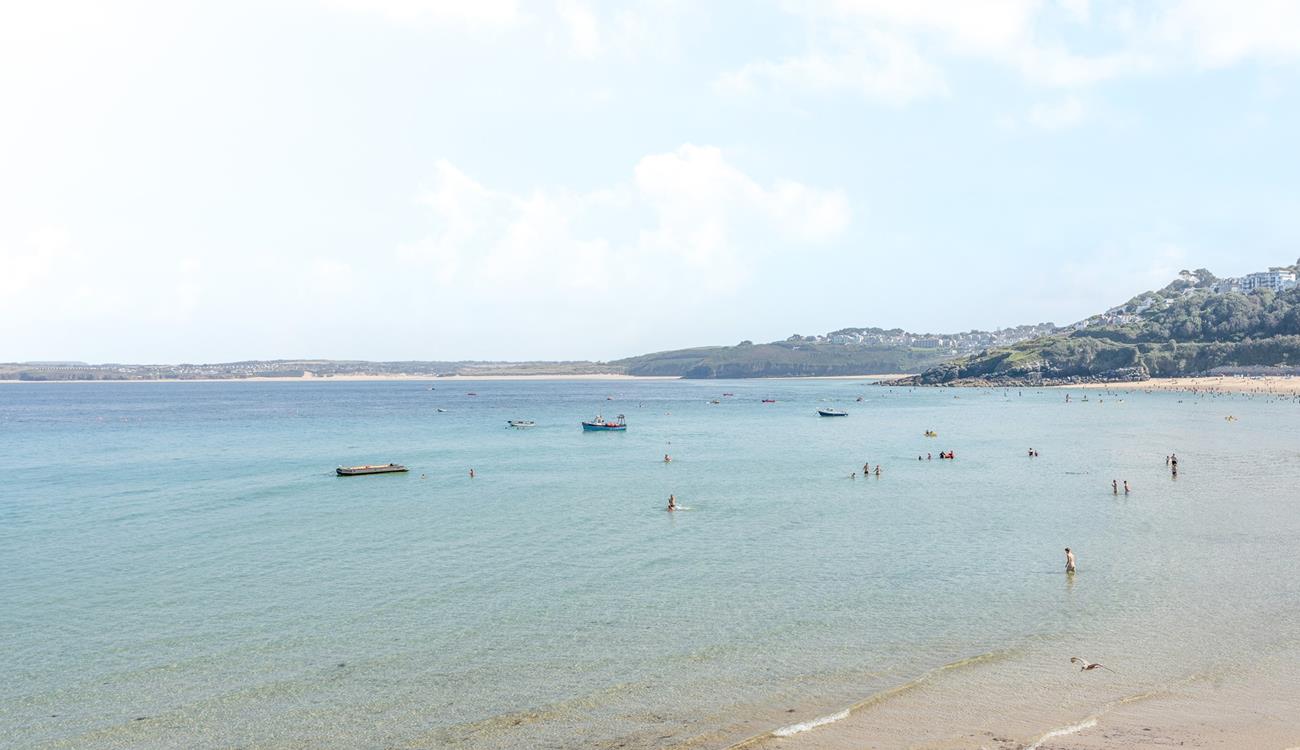 Sit on the beach and enjoy stunning views across St Ives Bay.