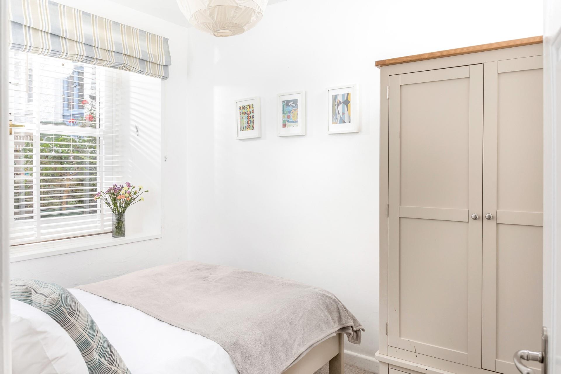 The double bedroom features stylish furniture to pack all your clothes away when you arrive.