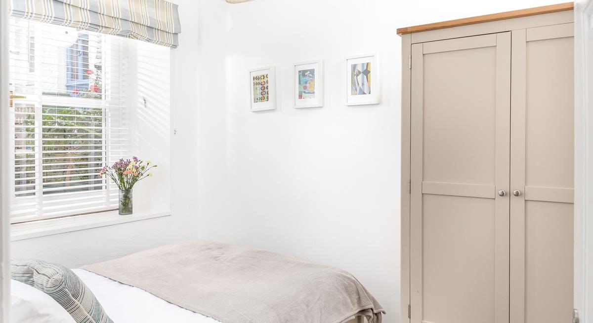 The double bedroom features stylish furniture to pack all your clothes away when you arrive.