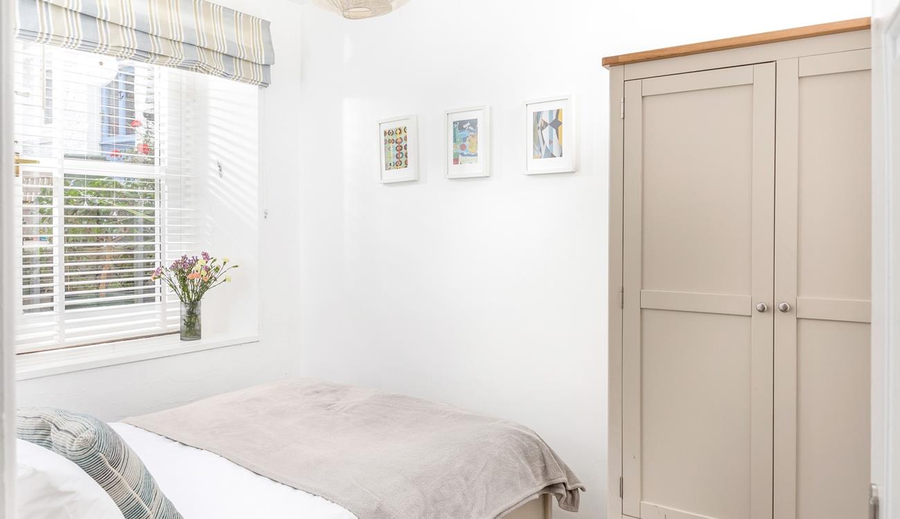 The double bedroom features stylish furniture to pack all your clothes away when you arrive.