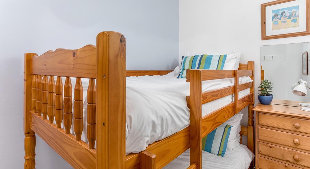 Tuck the kids into bed, exhausted from spending days at the beach.